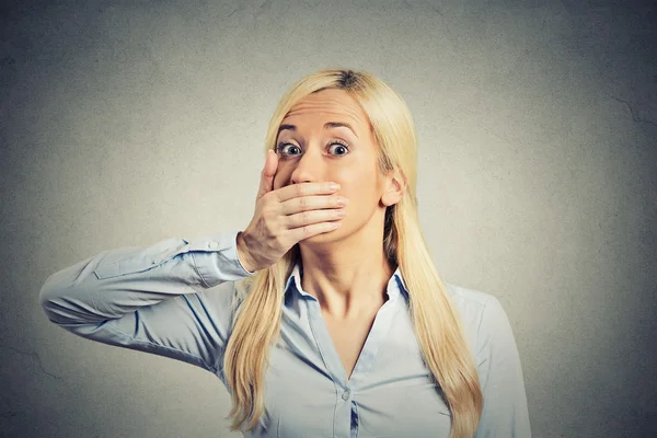 Shocked woman forced to cover her mouth with hand — Stock Photo, Image