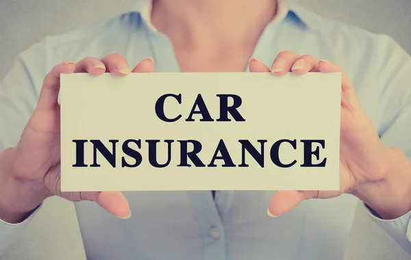 Closeup hands holding card sign car insurance text message — Stock Photo, Image