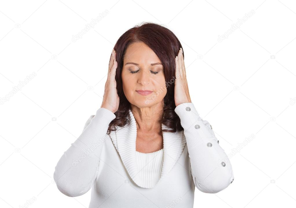 Portrait peaceful woman covering ears. Face expression 