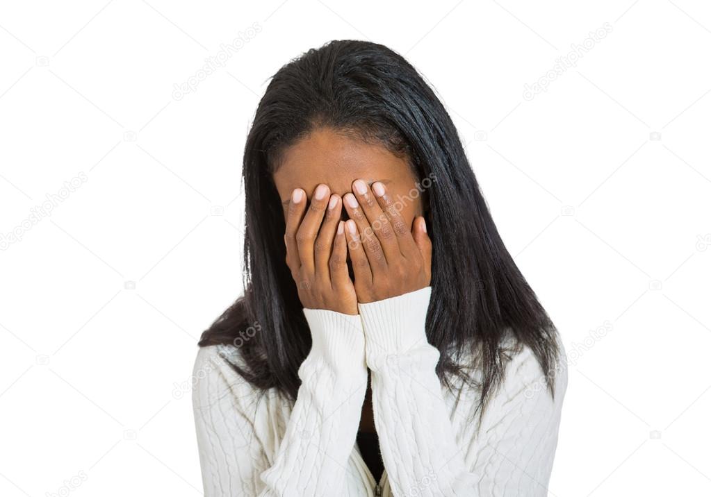 depressed stressed middle aged woman covering face with hands 