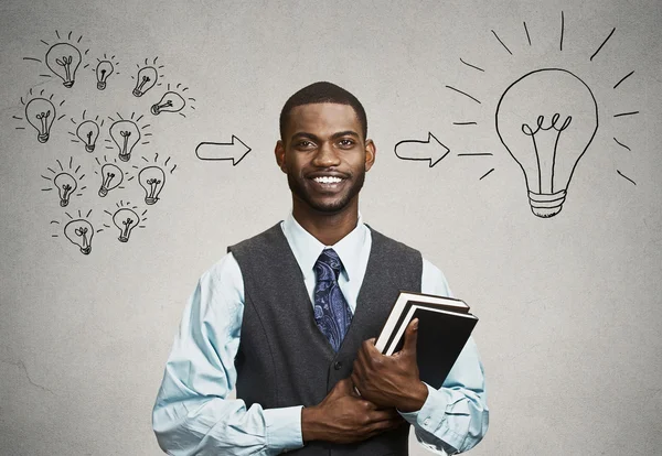 Confident young man, student holding books has big ideas — Stock Photo, Image