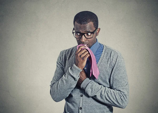 Portrait geeky nervous anxious man bitting chewing his tie — Stock Photo, Image