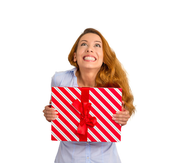 super excited funky woman with gift box looking up white background