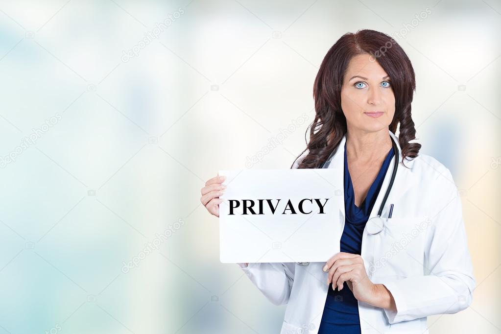 healthcare professional doctor scientist holding privacy sign