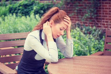 portrait stressed sad young woman outdoors. Urban life style stress  clipart