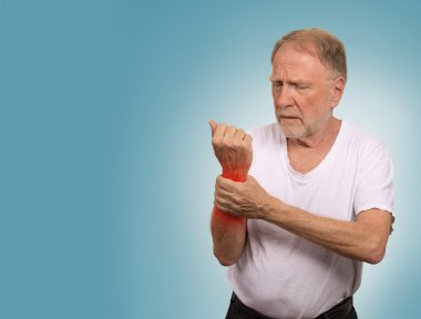 senior man in excruciating hand ache painful wrist arthritis  clipart