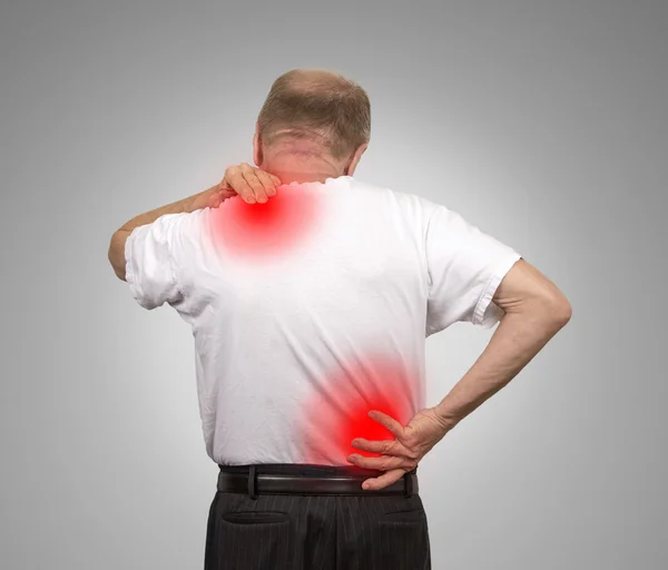 Senior man with lower and upper back pain — Stock Photo, Image