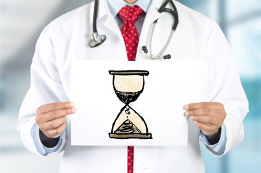 Doktor holding işareti ile san Saat eller.