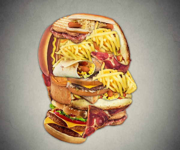 Unhealthy diet health concept fast food in shape of human head — Stock Photo, Image