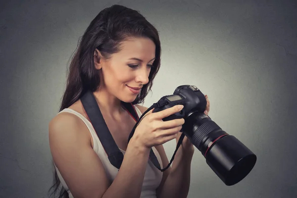 Closeup portrait young photographer using reflex camera — Stok fotoğraf