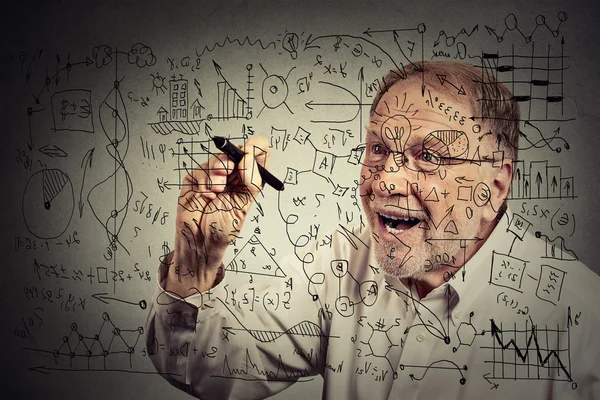 Senior man scientist with glasses writing secret formula with pen — Stockfoto