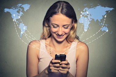 Happy woman using smartphone browsing internet worldwide 