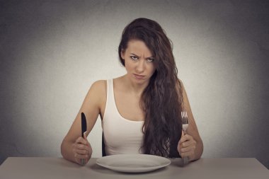 skeptical dieting woman tired of diet restrictions looking frustrated