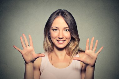  happy young woman making five times sign gesture with hands clipart