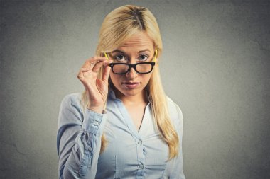 Skeptic woman doubtful looking at you 