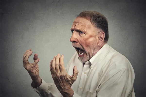 Side profile portrait of senior angry man — Stockfoto