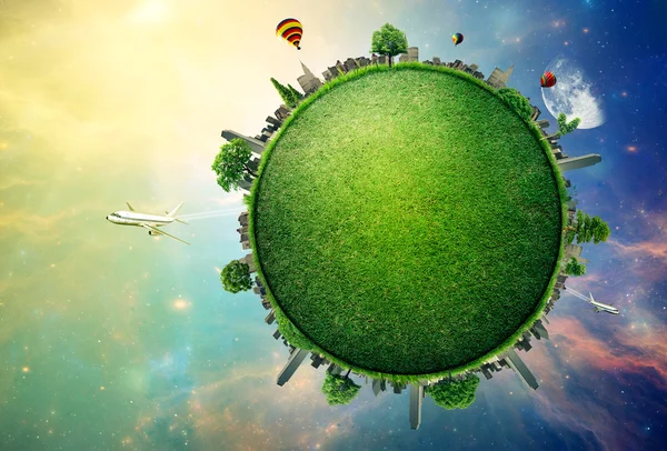 Green planet earth covered with grass city skyline — Stock Photo, Image