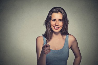 young beautiful casual woman pointing finger at you camera