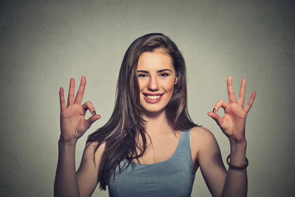 Optimistic woman giving ok sign gesture with two hands — Stok fotoğraf