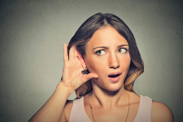 Surprised nosy woman hand to ear gesture carefully secretly listening — Stock Photo, Image