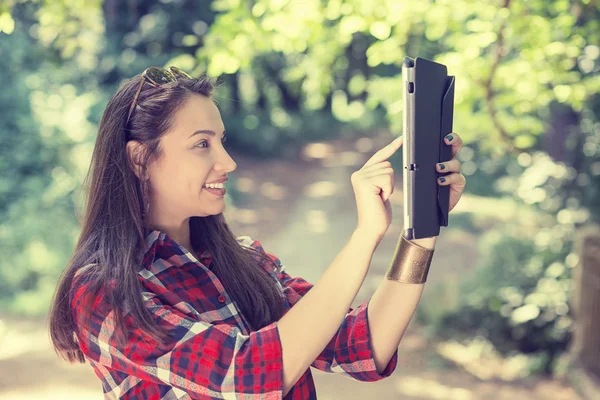 Beautiful young woman taking picture of herself, selfie with mobile pc — Stok fotoğraf
