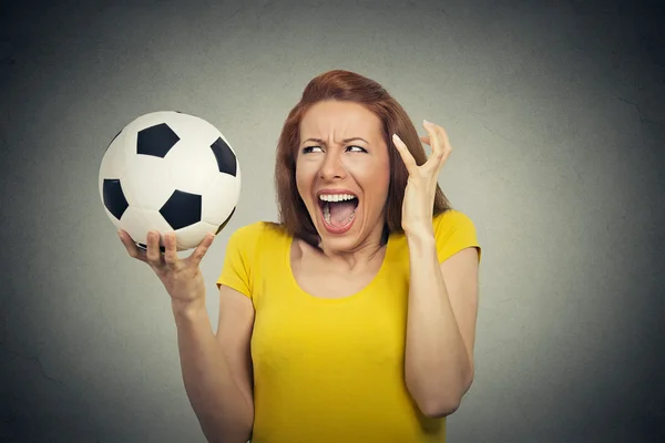 Angry frustrated woman screaming at soccer ball — Stock Photo, Image