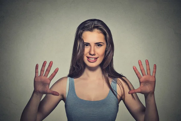 Smiling woman making five times sign gesture with hands fingers — Stock fotografie