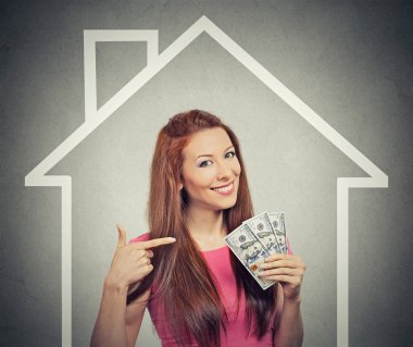 home, money, people concept. Successful business woman holding dollar cash money