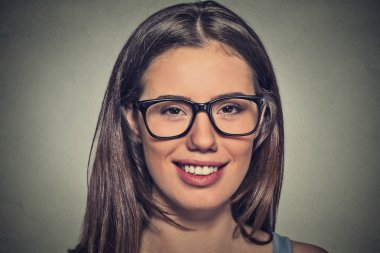 Attractive young woman with brown eyes in glasses