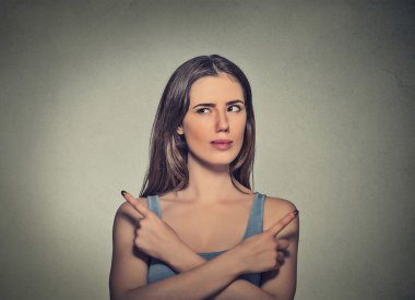 woman pointing in two different directions not sure which way to go in life
