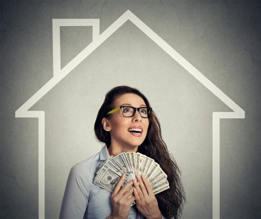home, money, people concept. Successful business woman holding dollar cash money