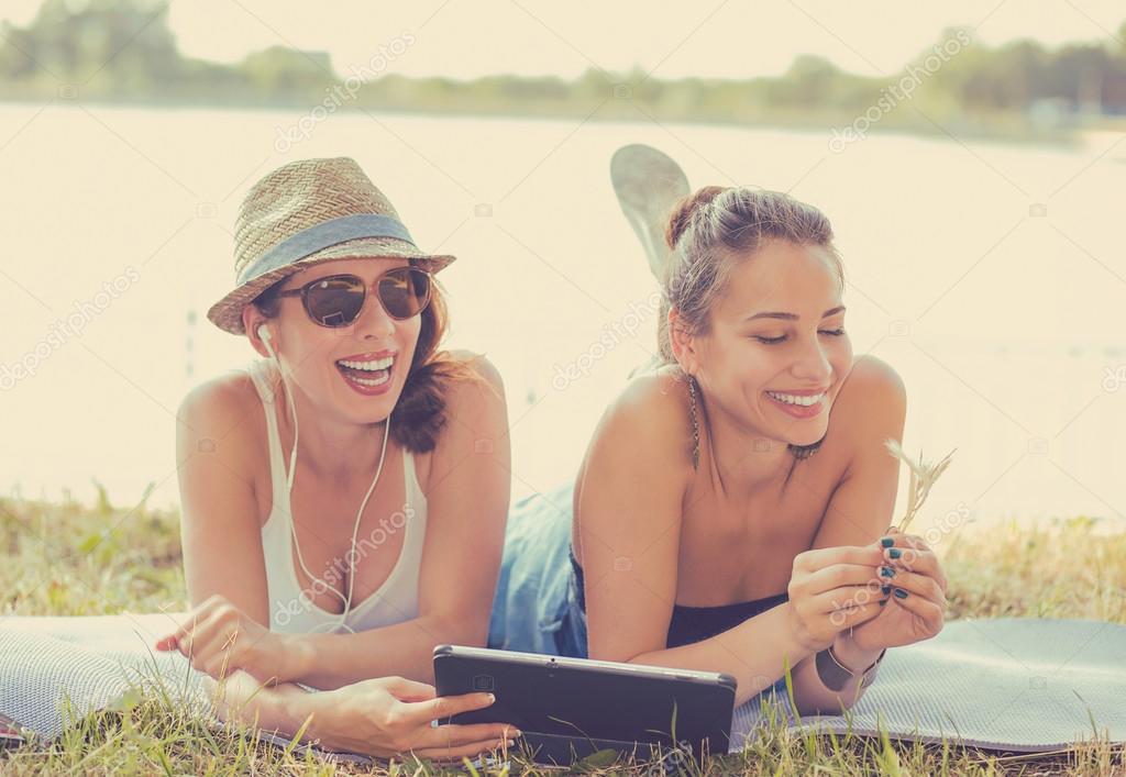 Two funny happy young women friends enjoying summer day outdoors Stock Photo by ©SIphotography 80092622 Two funny happy young women friends enjoying summer day outdoors Stock Photo by ©SIphotography 80092622