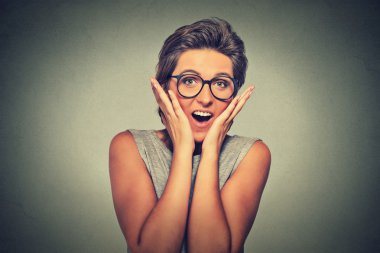 happy young woman looking excited surprised in full disbelief it's me?