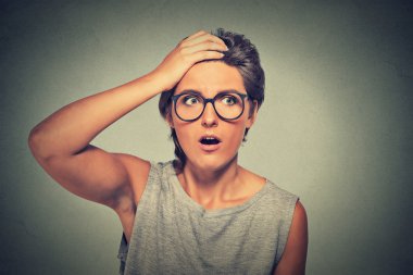 Surprise astonished woman with glasses looking surprised in full disbelief