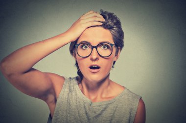 Surprise astonished woman with glasses looking surprised in full disbelief