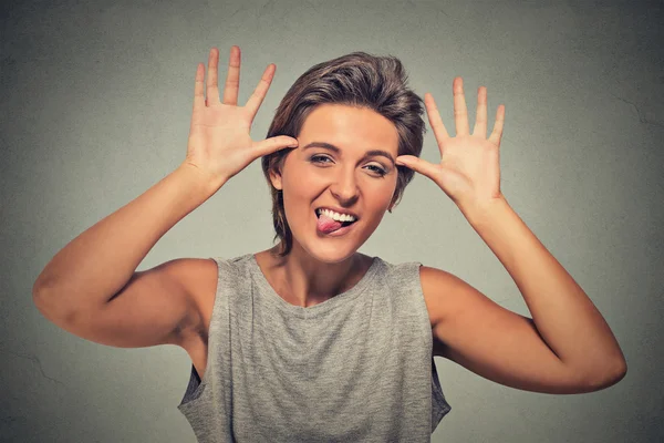 Young, childish, foolish rude woman sticking tongue out — Stok fotoğraf