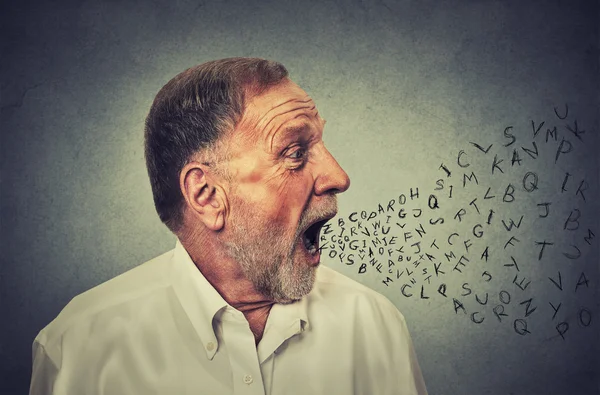 Man talking with alphabet letters coming out of his mouth — Stock Photo, Image