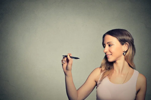 Young woman drawing writing on board with empty copy space — Stok fotoğraf