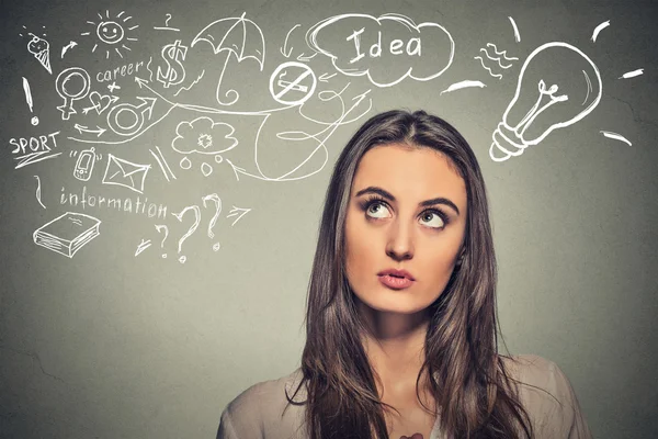 Beautiful woman thinking looking up — Stock Photo, Image