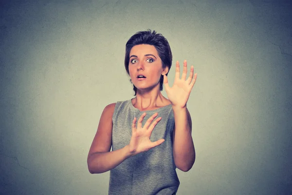 Young woman looking shocked scared trying to protect herself — Stok fotoğraf