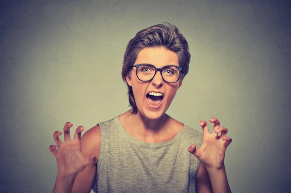 Angry young woman with glasses screaming — ストック写真