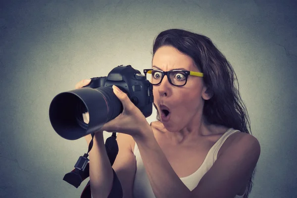 Closeup funny looking young woman with digital camera — Stock Photo, Image