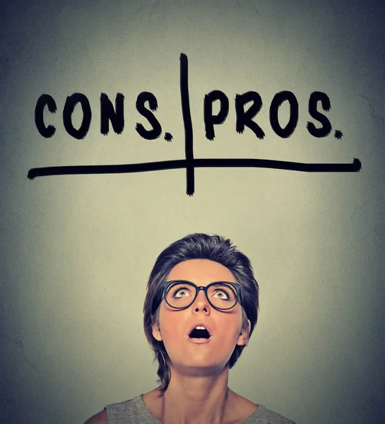 Pros and cons, for and against argument concept. Woma deciding — Stock Image Pros and cons, for and against argument concept. Woma deciding Stock Photo