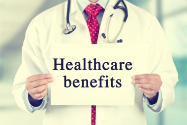 doctor hands holding card sign with healthcare benefits text message
