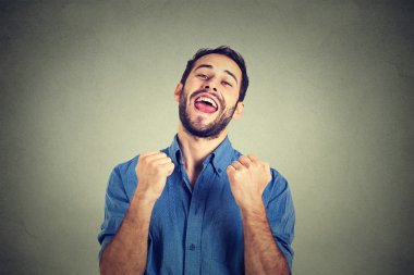 happy successful student, business man winning, fists pumped celebrating success