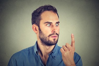 Shocked man looking at his finger
