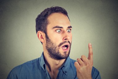 Shocked man looking at his finger