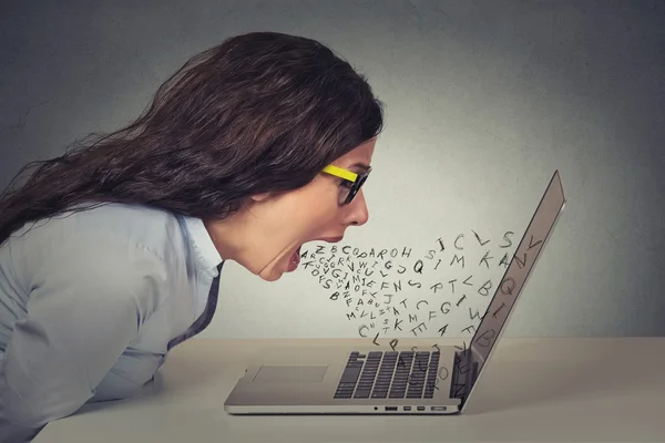 Angry furious businesswoman working on computer, screaming — Stok fotoğraf