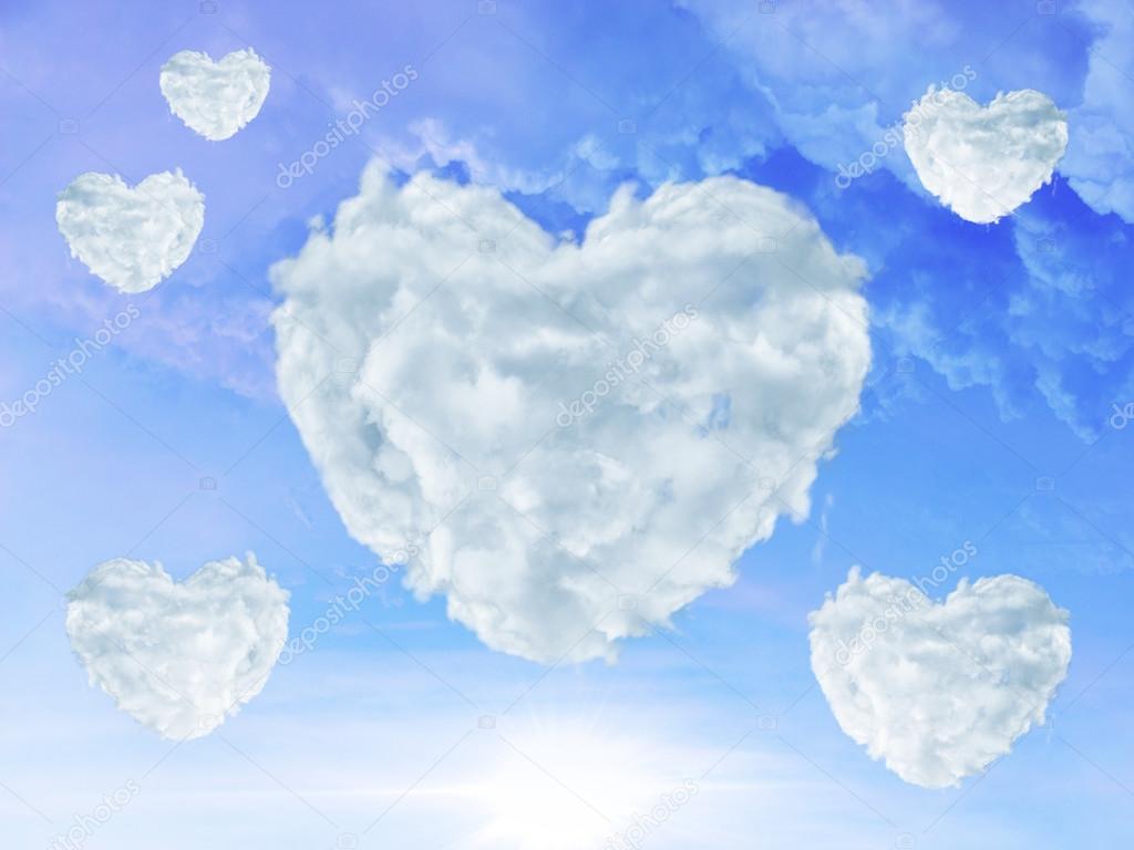 blue sky with clouds shaped as heart. Love concept