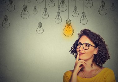 thinking woman in glasses looking up with light idea bulb above head clipart